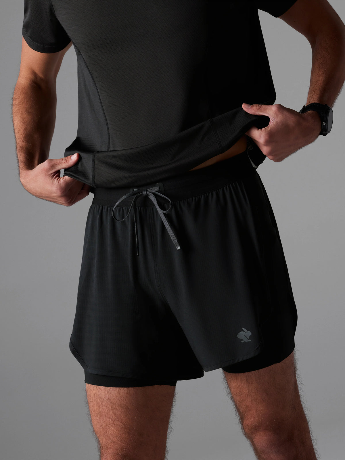 Men's rabbit Pacer Hybrid Shorts 5". Black.
