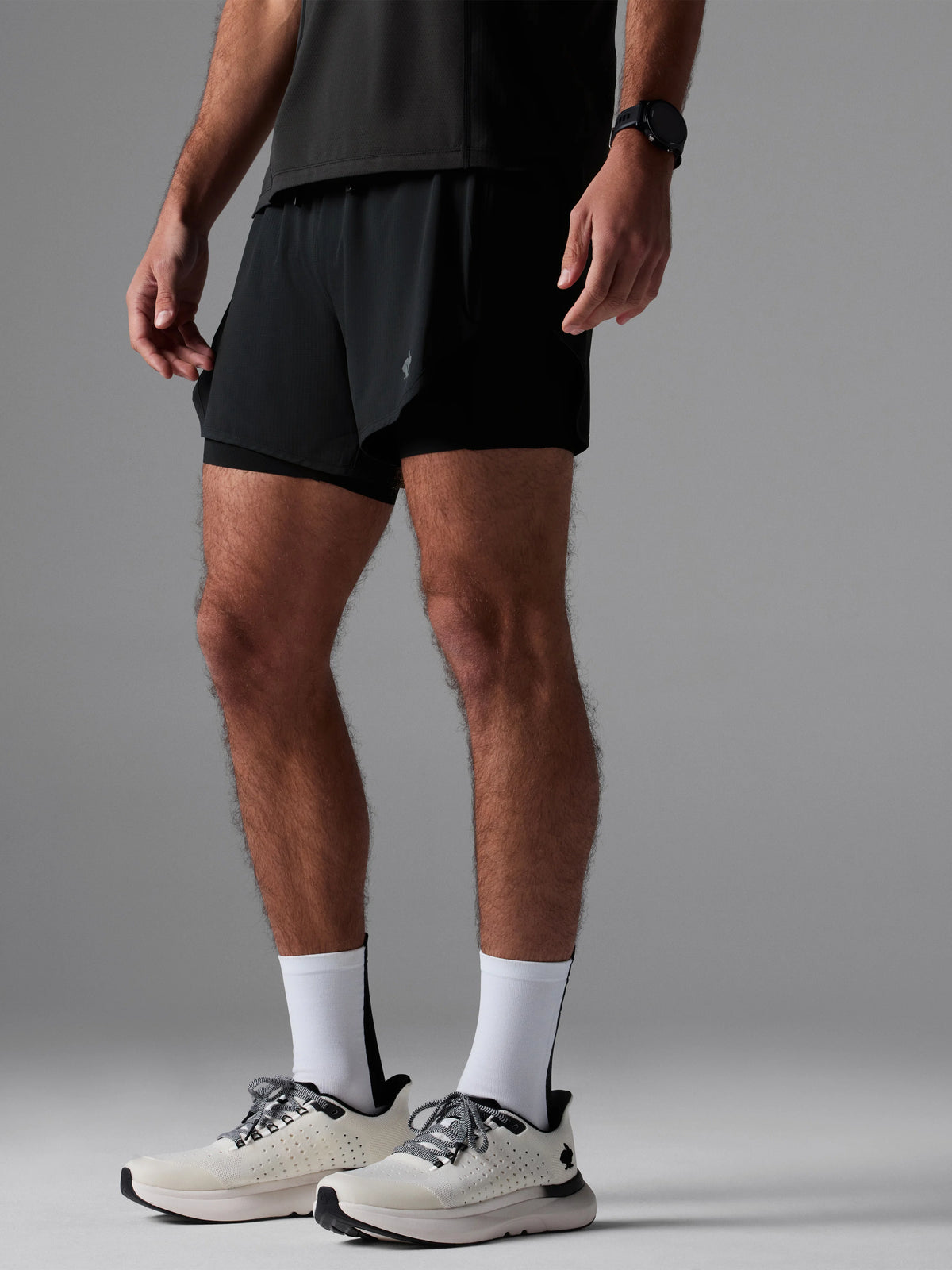 Men's rabbit Pacer Hybrid Shorts 5". Black.