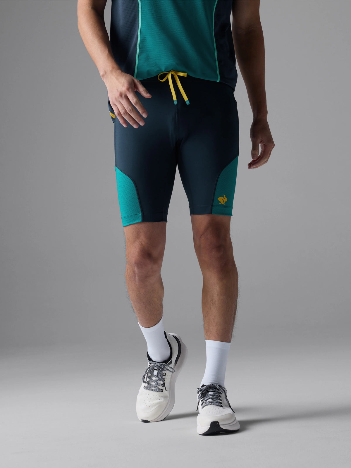 Men's Rabbit Pacer Shorts 8.5in. Navy and turqoise colorway. Front view.