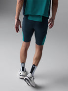 Men's Rabbit Pacer Shorts 8.5in. Navy and turqoise colorway. Back view.