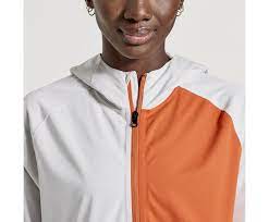 Men's Saucony Boulder Drizzle Jacket. White and orange color way. Front view.