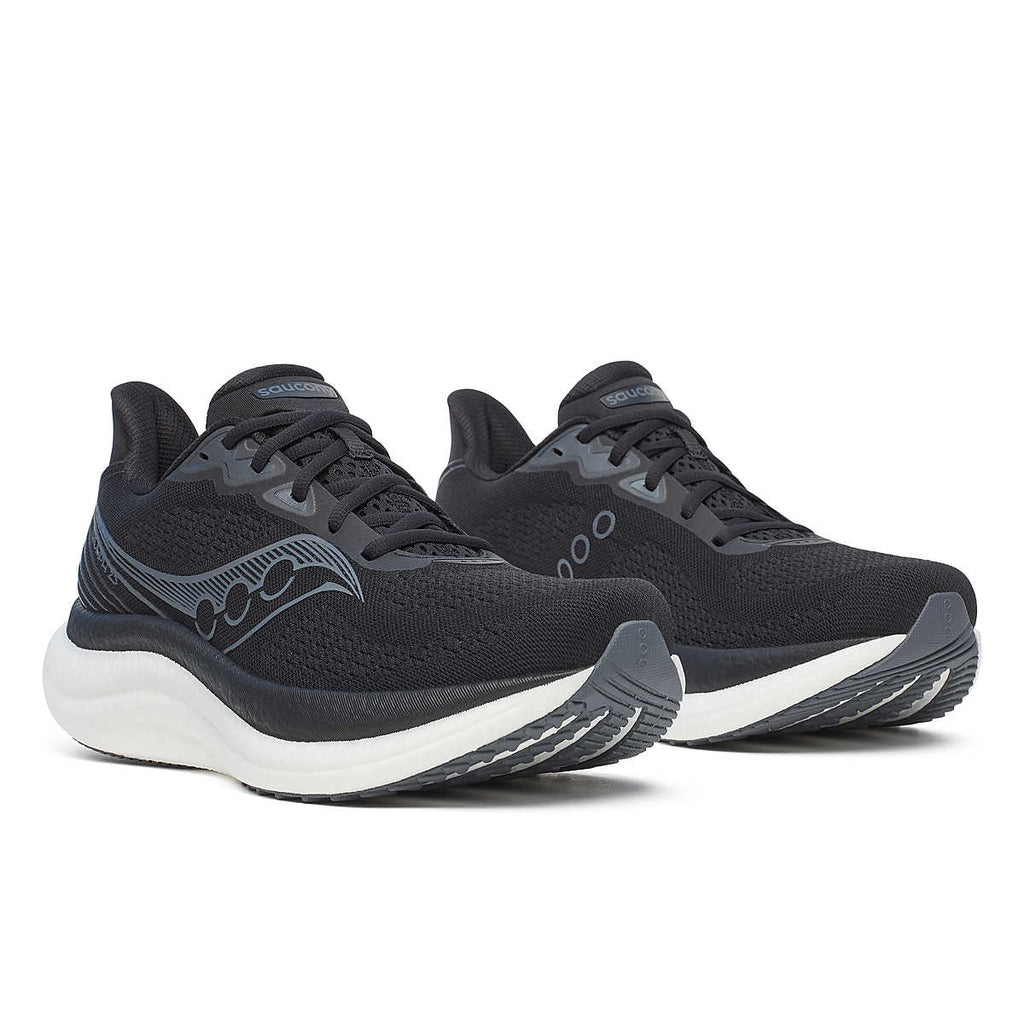 Men's Saucony Triumph 23. Black upper. White midsole. Lateral view.