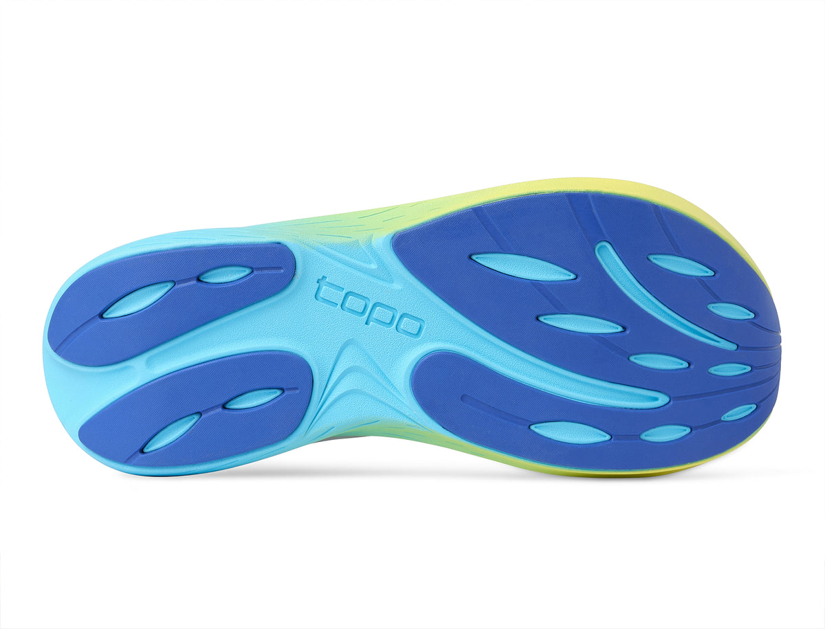 Men's Topo Atmos 2. White upper. Blue/Yellow midsole. Bottom view.