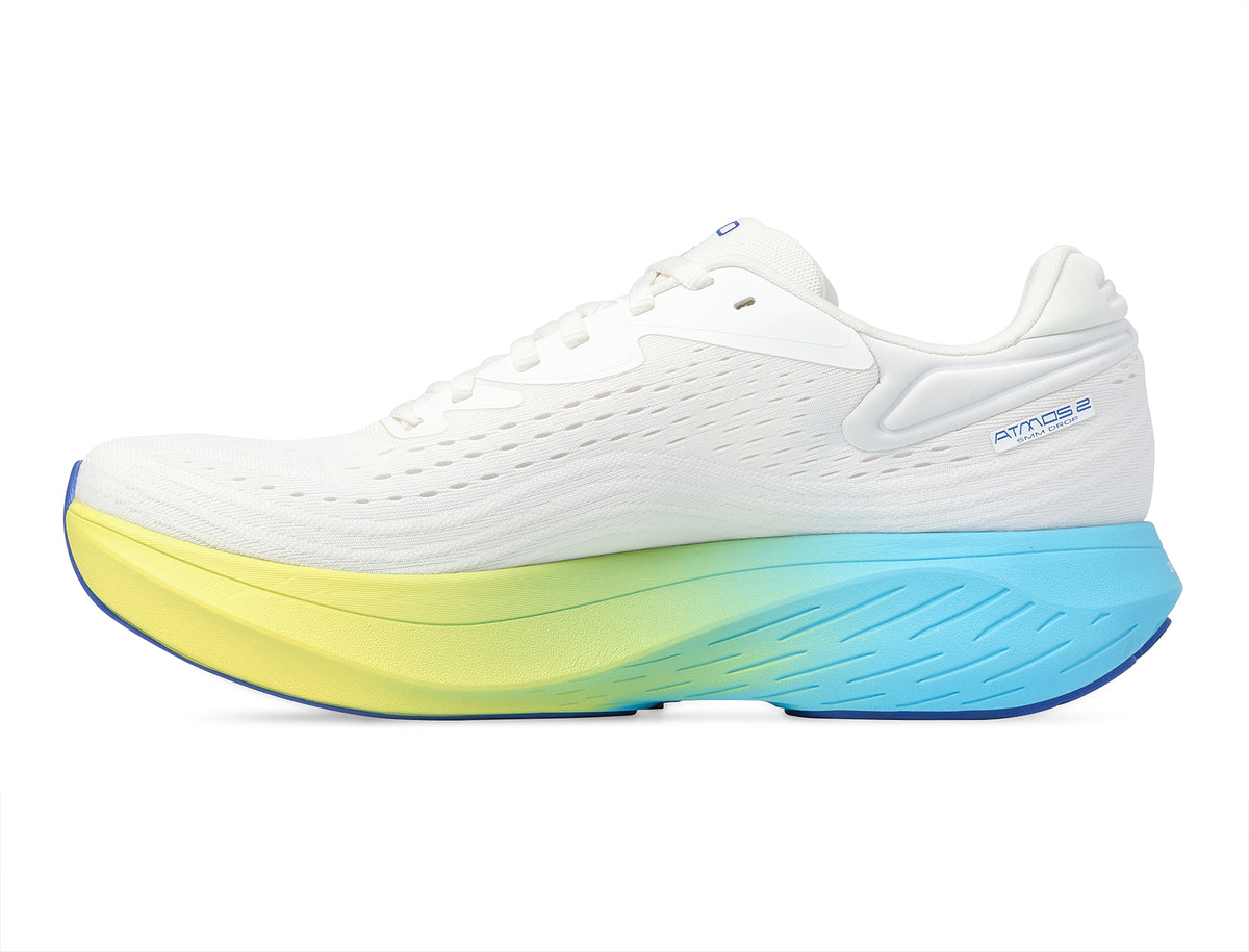 Men's Topo Atmos 2. White upper. Blue/Yellow midsole. Medial view.