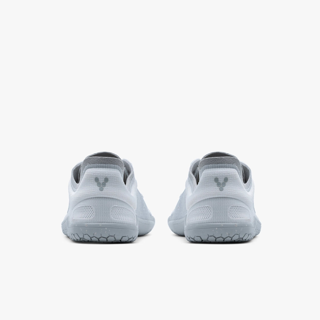 Men's Vivobarefoot Primus Lite 3.5. Light Grey upper. Grey outsole. Rear view.