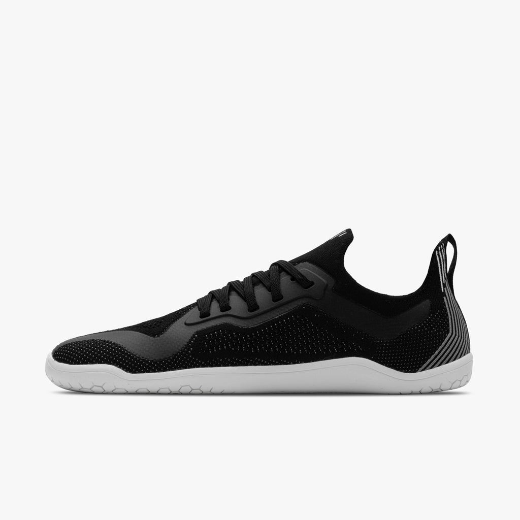 Men's Vivobarefoot Primus Lite Knit. Black upper. White outsole. Medial view.