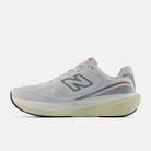 New Balance 1080 v15 men's running shoe in White/Neo Flame — medial view