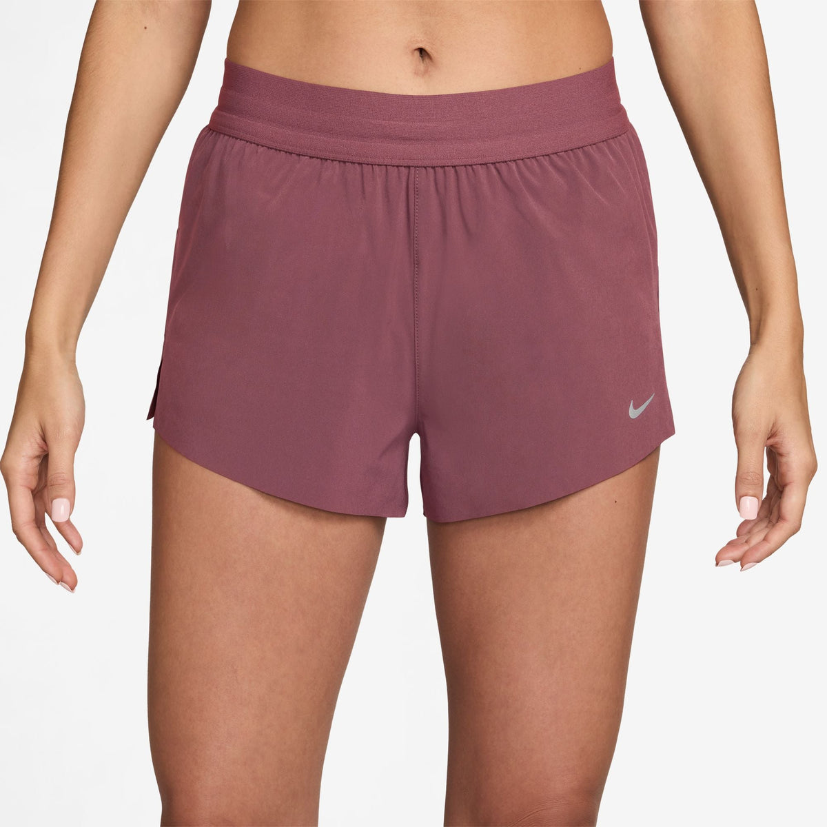 Women's Nike Dri-FIT Mid-Rise 2.5-inch Running Shorts in Pink Smoke, front view.