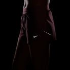 Women's Nike Dri-FIT Mid-Rise 2.5-inch Running Shorts in Pink Smoke, reflective detail.