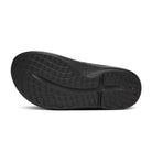 Oofos OOahh Limited Slide women's Black/Blossom colorway, outsole view.