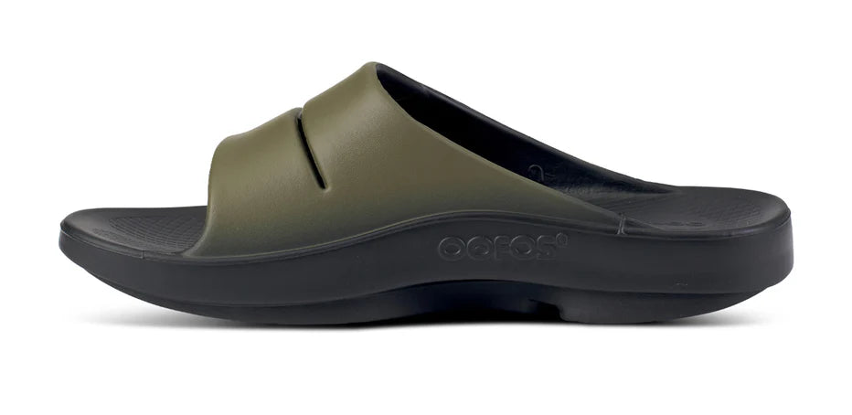 Oofos Ooahh Sport Slide. Green upper. Black midsole. Medial view.