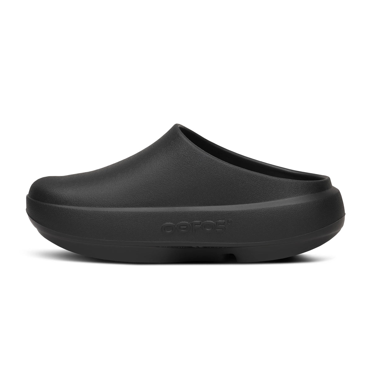 Oofos Ooclog+ Clog. Black colorway. Medial view.