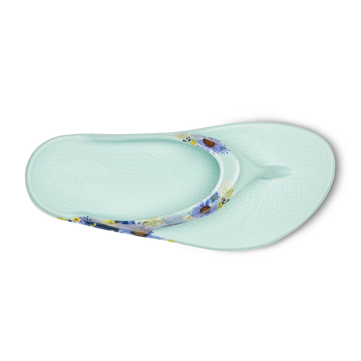 Oofos Oolala Limited Thong. Mint colorway with floral pattern. Top view.