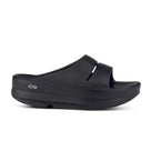 Womens Oofos Oomega Ooahh. Black. Lateral view.