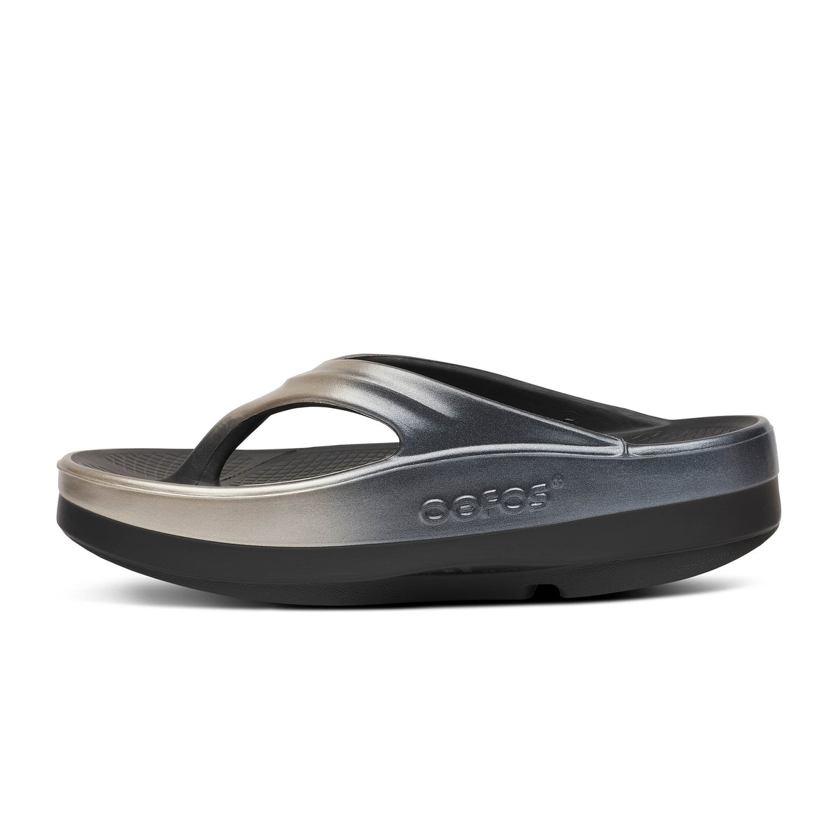 Women's OOFOS OOmega OOlala Luxe Sandal in Latte Fade. Gold and black. Medial view.