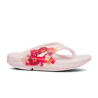 Oofos Ooriginal Limited Thong. Pink colorway with floral pattern. Lateral view.