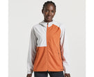 Women's Saucony Boulder Drizzle Jacket. Orange/White. Front view.