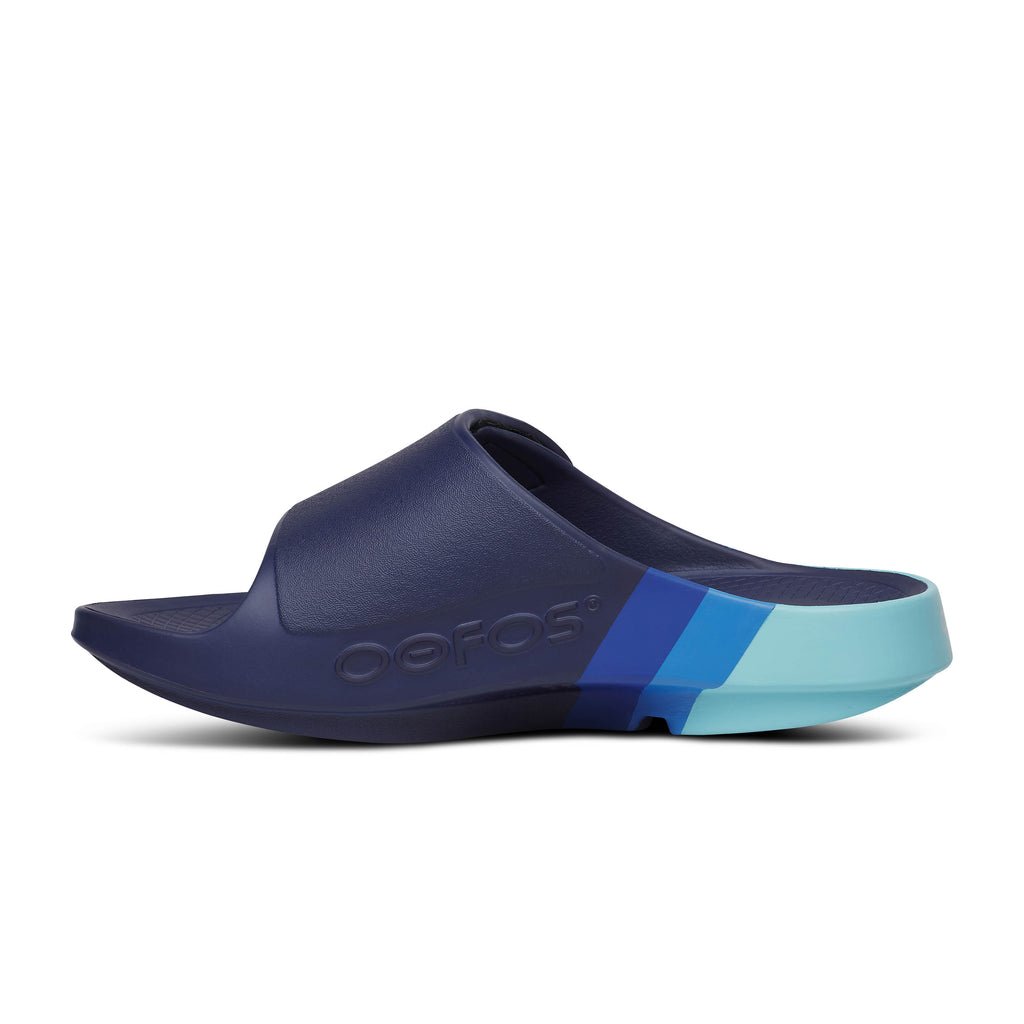 Unisex Oofos Ooahh Sport Flex Sandal. Blue. Medial view.