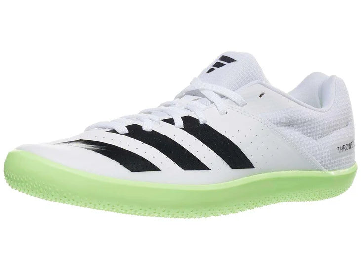 white sneaker with black stripes and green bottom. lateral view.