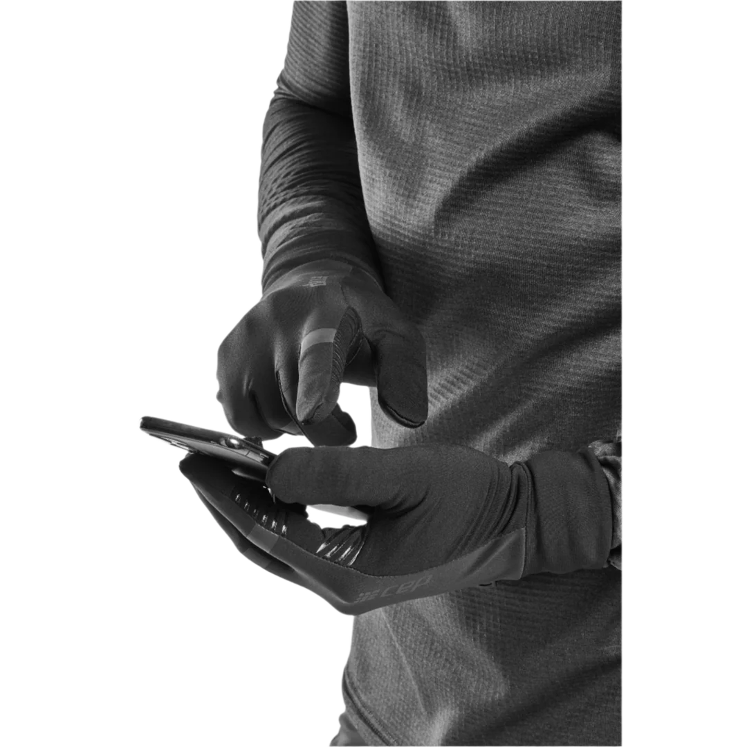 Unisex CEP cold weather gloves. Black. Using phone with gloves on. 