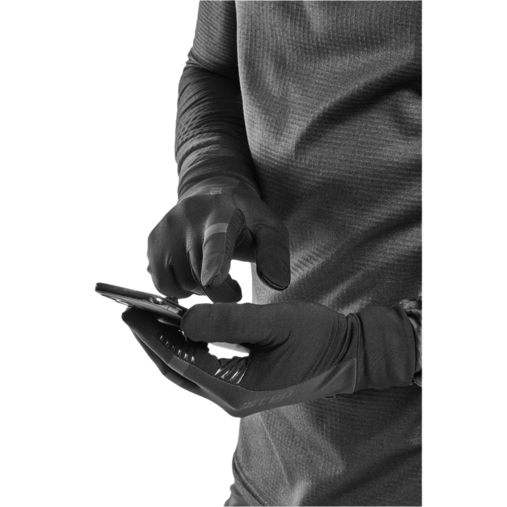Unisex CEP cold weather gloves. Black. Using phone with gloves on. 