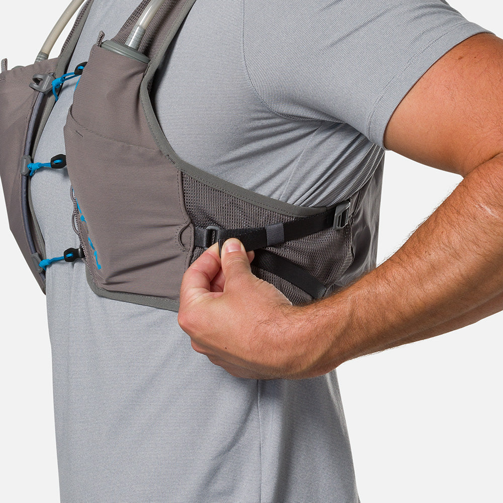 Unisex Nathan Breeze 4 Liter Hydration Vest. Grey with blue logo. Side view.