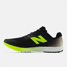 New Balance FuelCell X-7 v5. Black upper. Green/White midsole. Medial view.