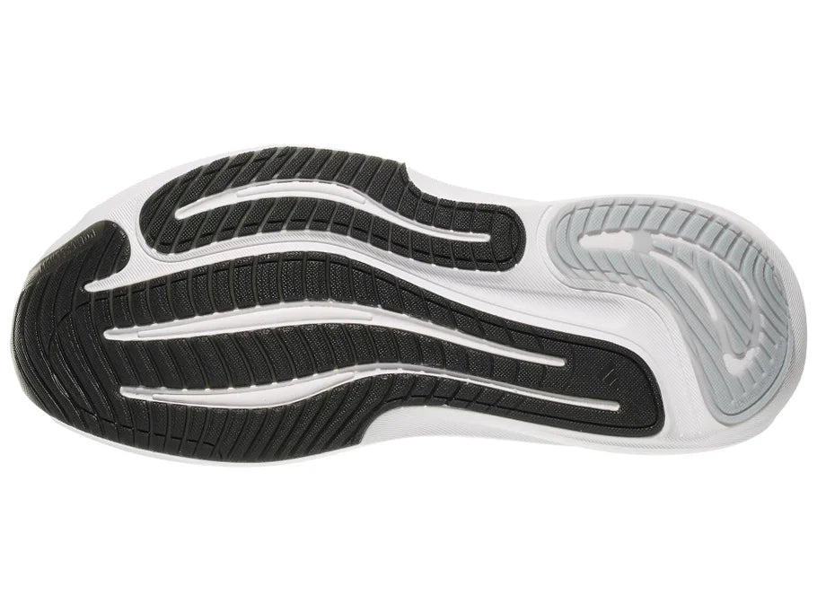 Women's Adidas Supernova Adaptive. Black upper. White midsole. Bottom view.