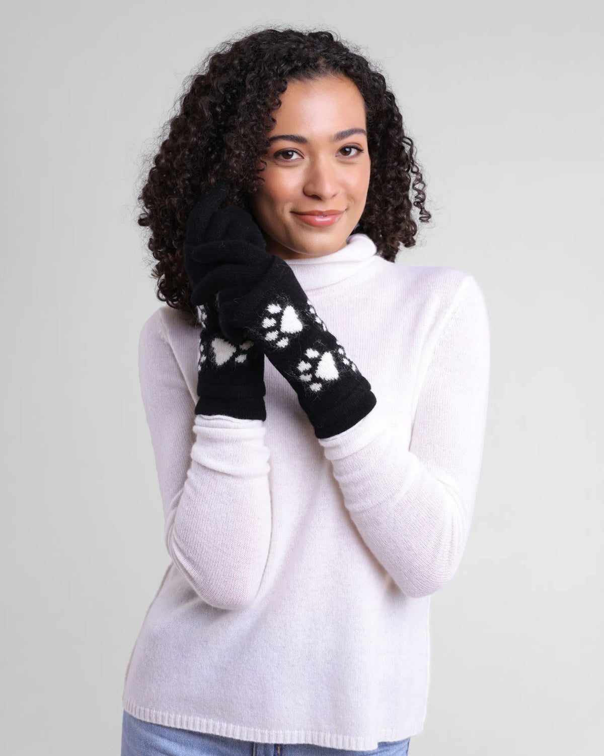 Women's Alashan Cashmere Cashmere/Angora 3-in-1 Paw Print Gloves. Black with white paw print pattern. 