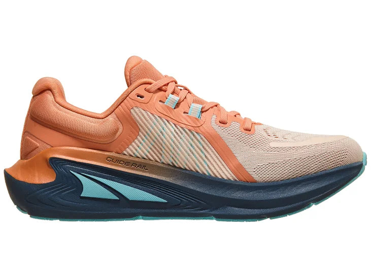 Women's Altra Paradigm 7. Light pink upper. Navy midsole. Medial view.