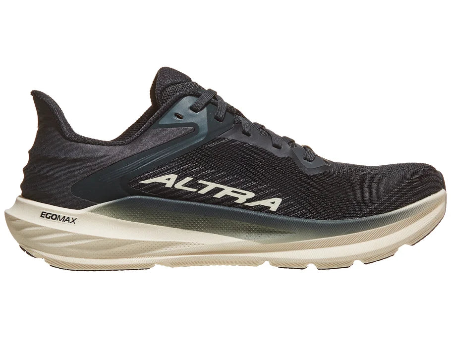 Women's Altra Torin 8. Black upper. White midsole. Medial view.