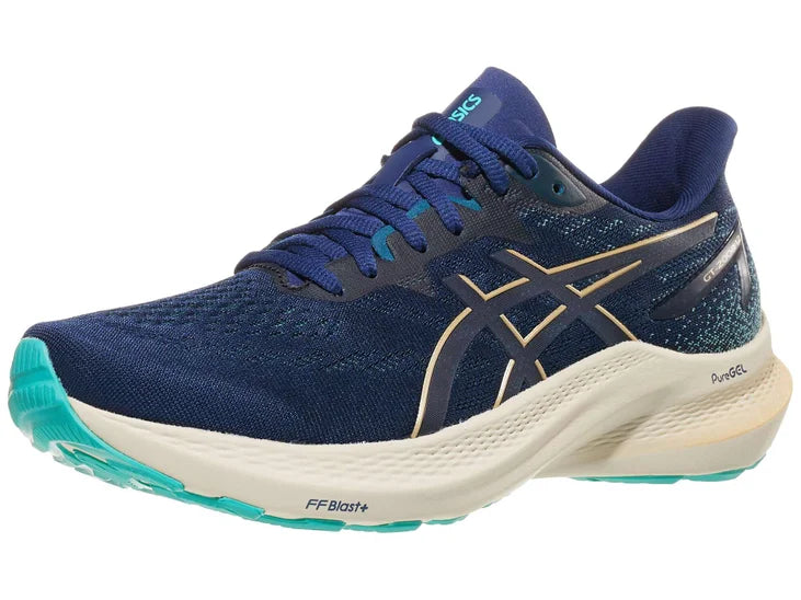 Women's Asics GT-2000 12. Blue upper. Off white midsole. Lateral view.