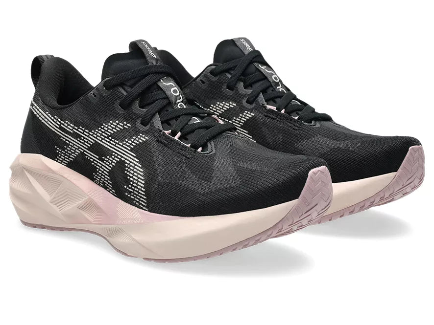 Women's Asics Novablast 5. Black upper. White midsole. Lateral view.