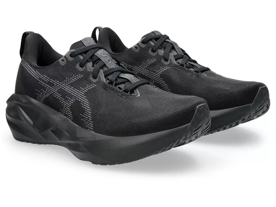 Women's Asics Novablast 5. Black upper. Black midsole. Lateral view.