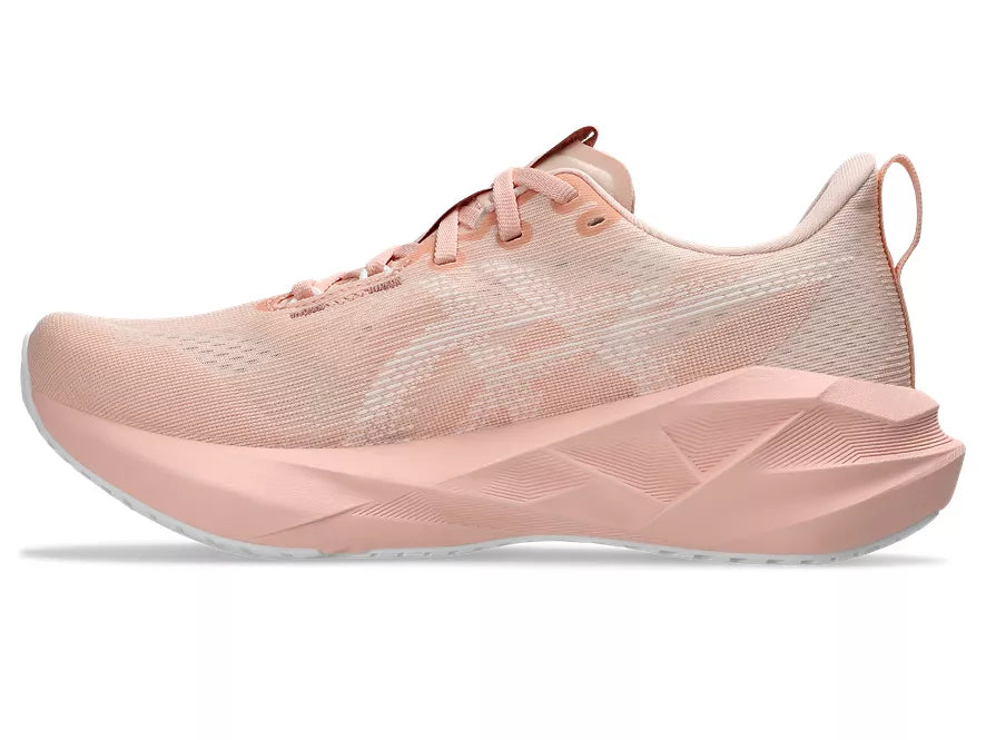 Women's Asics Novablast 5. Light Pink upper. Light Pink midsole. Medial view.