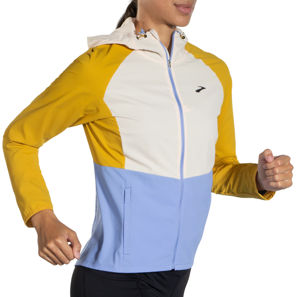 Women's Brooks Canopy Jacket. White/Orange/Light Blue. Front/Lateral view.