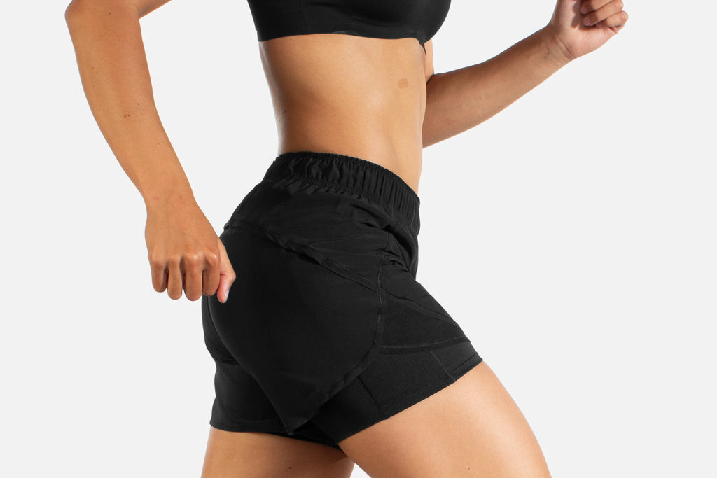 Women's Brooks Chaser 5" 2-in-1 Shorts. Black. Lateral view.