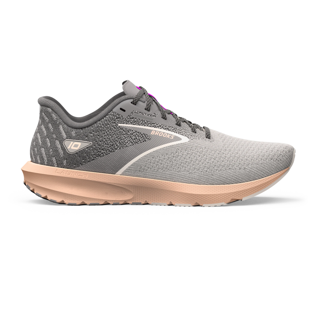 Women's Brooks Launch 10. Grey upper. Off pink midsole. Lateral view.