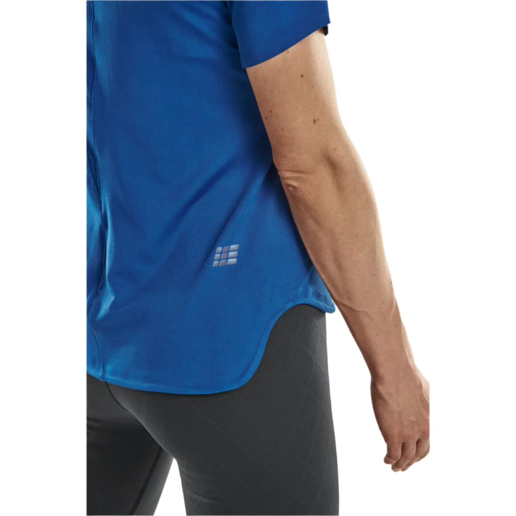 CEP Run Shirt 4.0 Short Sleeve Women's. Blue. Back view showing waist line. 