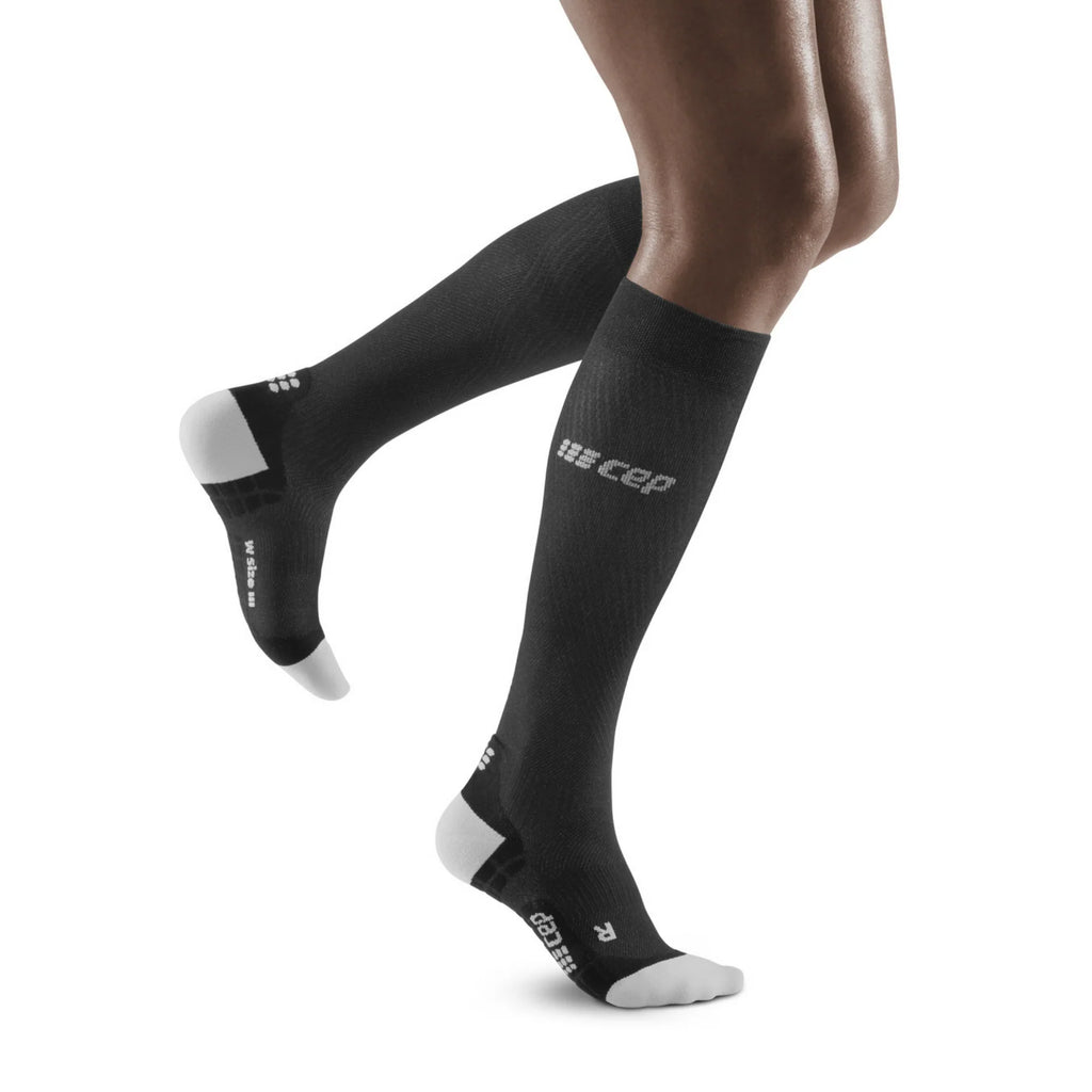Women's CEP Ultralight Compression Socks. Black. Lateral view.