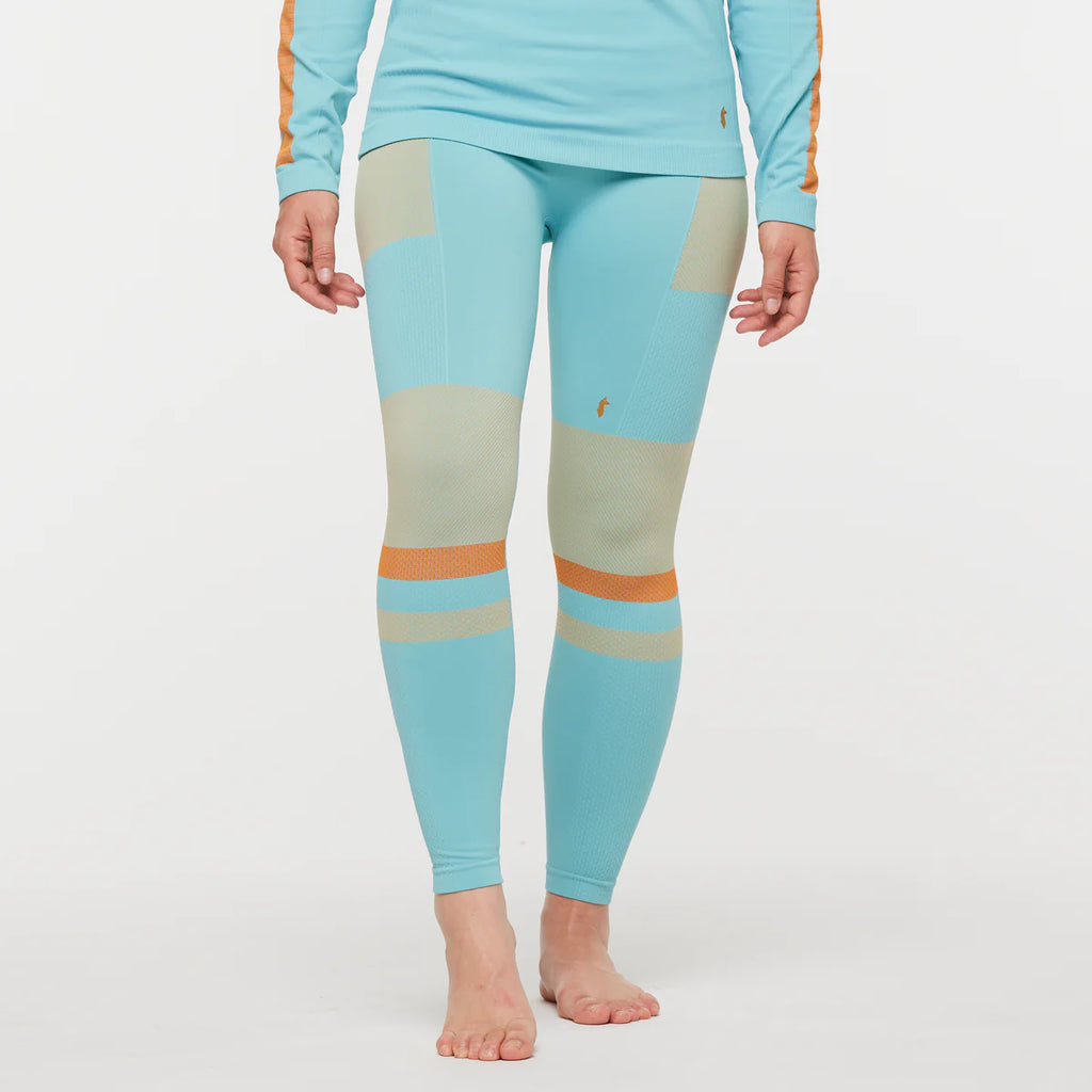 Women's Cotopaxi Debajo Seamless Baselayer Tights. Blue, tan, and orange pattern. Front view. 