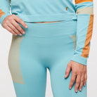 Women's Cotopaxi Debajo Seamless Baselayer Tights. Blue, tan, and orange pattern. Front view. 