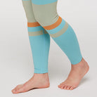 Women's Cotopaxi Debajo Seamless Baselayer Tights. Blue, tan, and orange pattern. Lateral, bottom view.