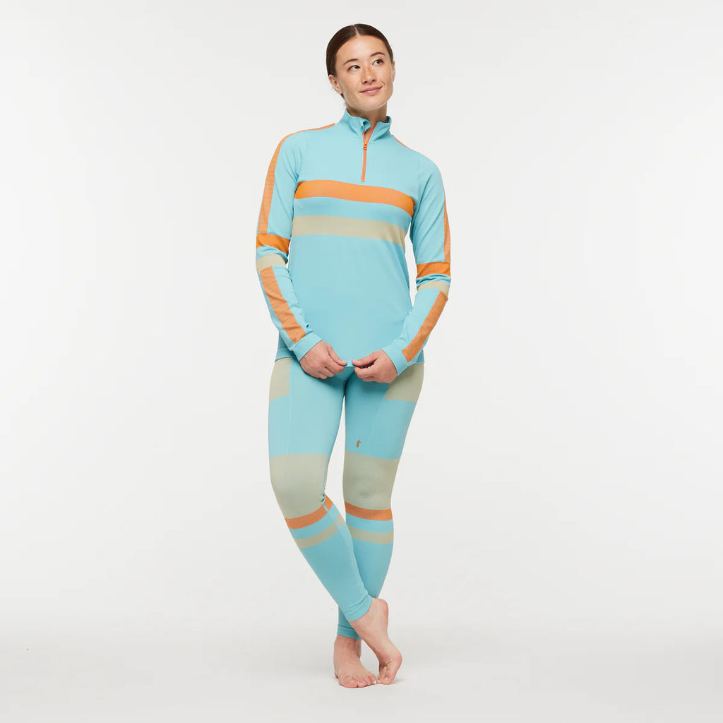 Women's Cotopaxi Debajo Seamless Baselayer Tights. Blue, tan, and orange pattern. Front view.