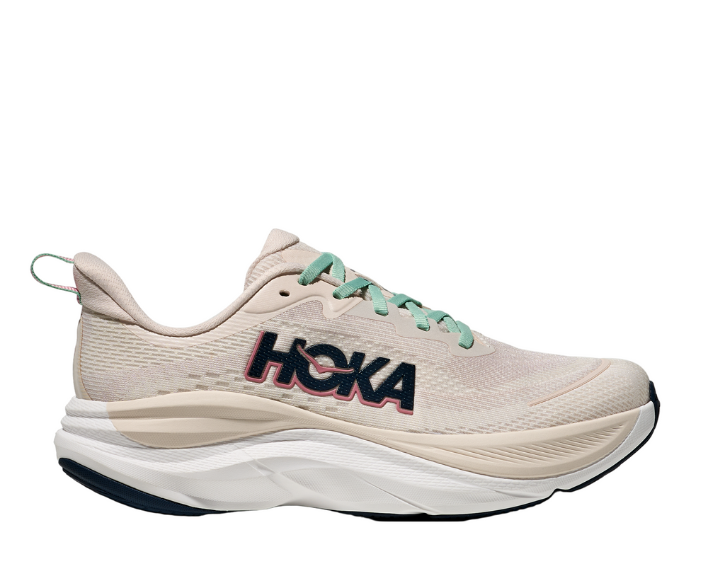 Women's Hoka Skyflow. Cream upper. White midsole. Lateral view.