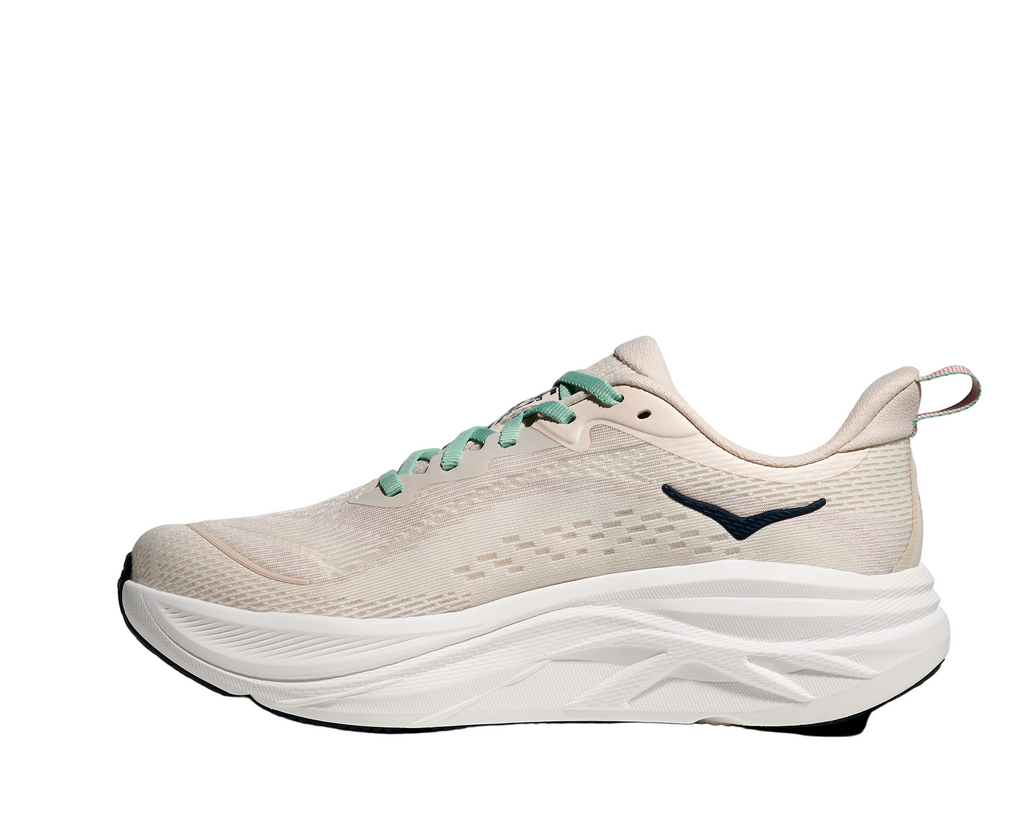 Women's Hoka Skyflow. Cream upper. White midsole. Medial view.