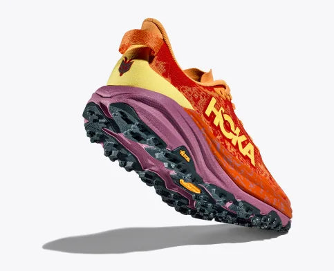 Women's Hoka Speedgoat 6. Red upper. Red/Purple midsole. Rear/Lateral view.