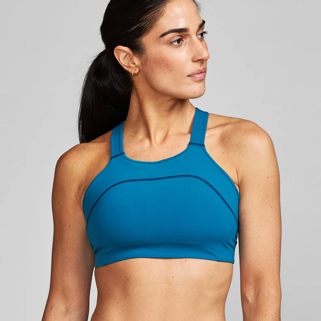 Women's Janji Ascend Sports Bra. Blue colorway. Front view.