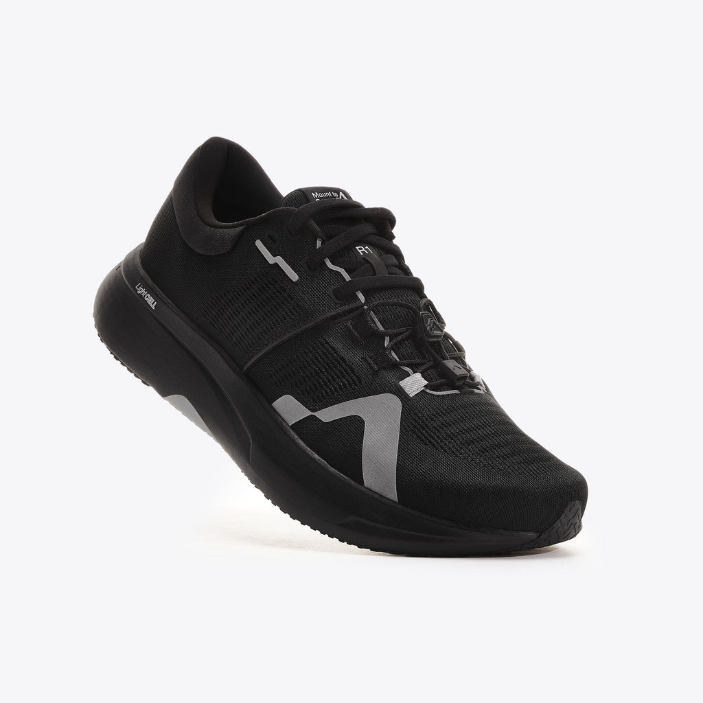 Women's Mount to Coast. R1. Black upper. Black midsole. Lateral view.