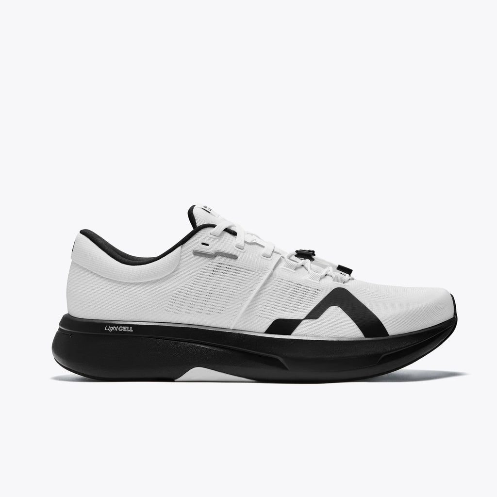 Women's Mount to Coast. R1. White upper. Black midsole. Lateral view.